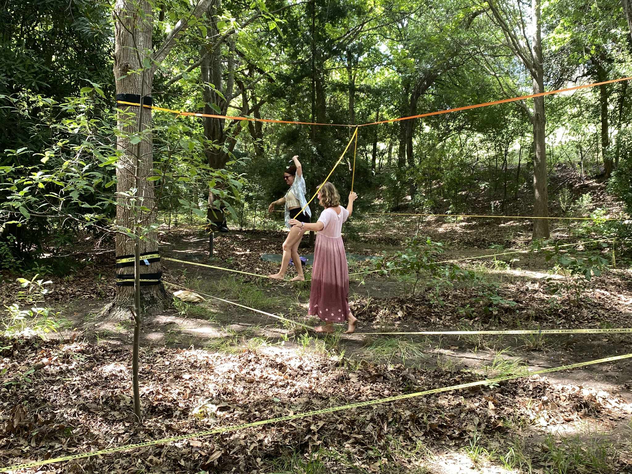 Fascilitators Britt and Emma walking the slacklines